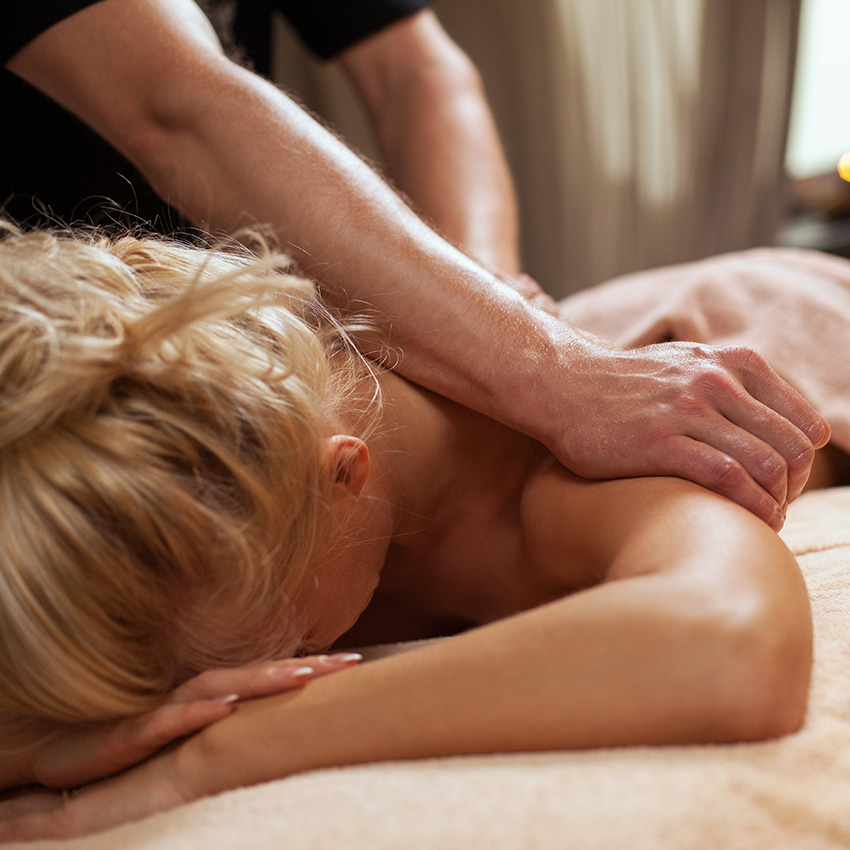 Woman receiving relaxing back massage