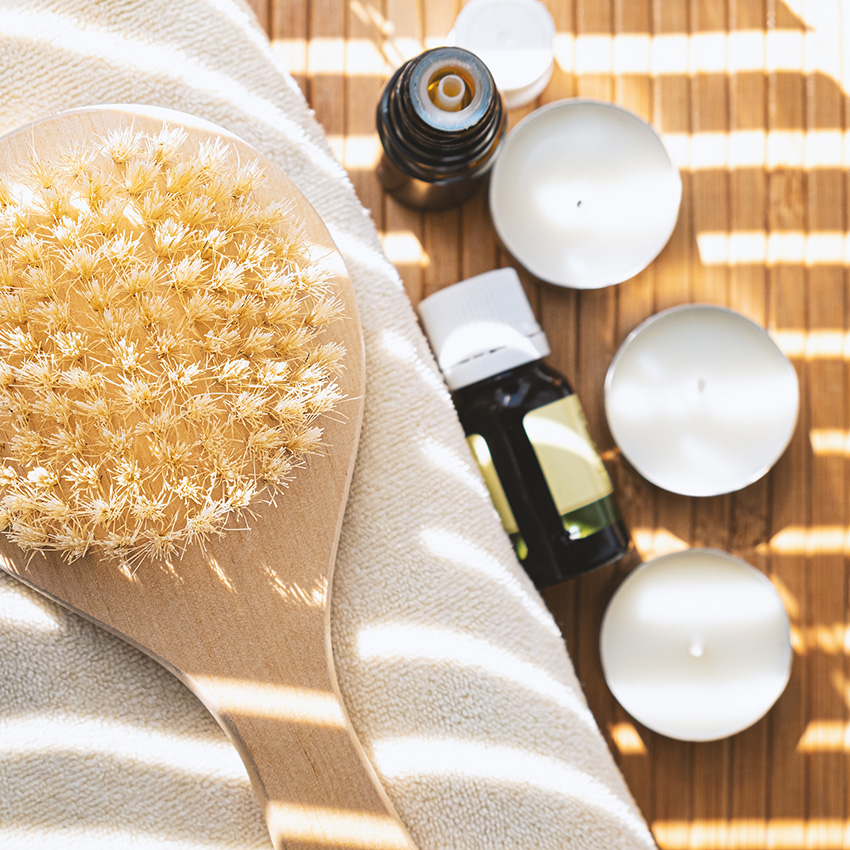 Woman with towel receiving face massage